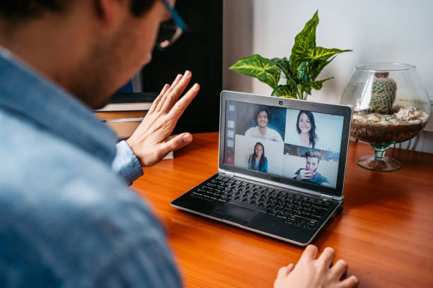 istock Man having a video call with friends 1220170026