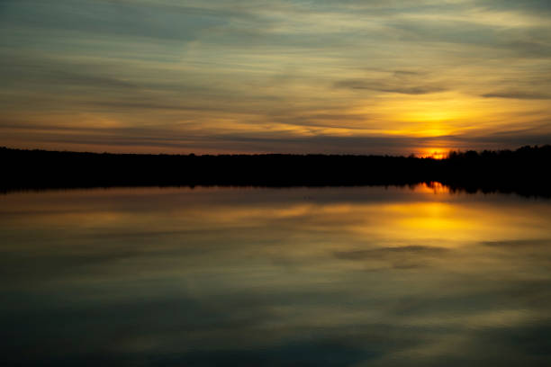 istock Beautiful sunset reflected in the lake. Scenic landscape 1220170971
