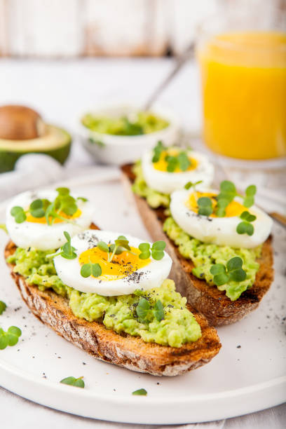 istock Avocado Sandwich with Egg and Micro green. Healthy breakfast concept 1220171277