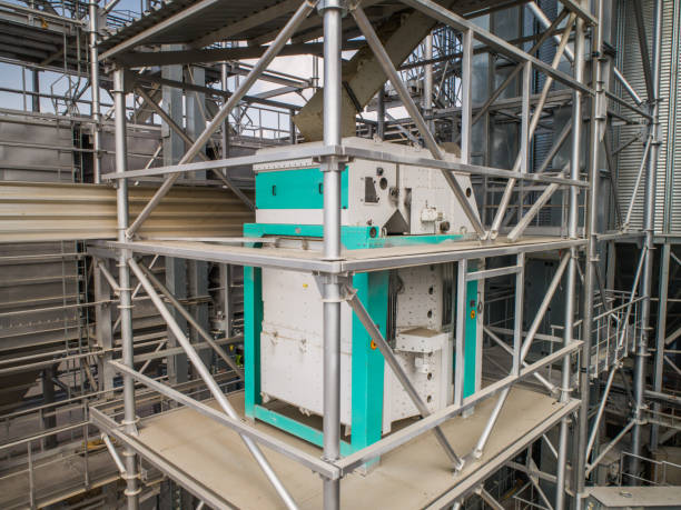 istock Metal structures of grain dryer and separator at the grain terminal. 1220171786
