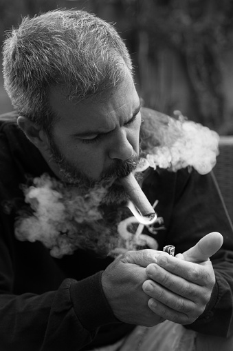 Man lighting a cigar