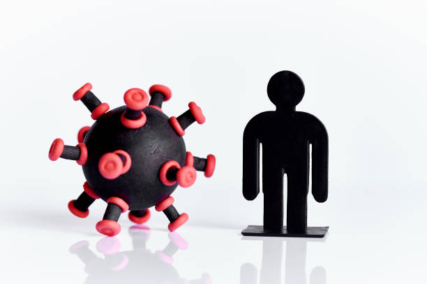 istock Silhouette of a person surrounded by a virus on a white background. Stay home and quarantine concept. 1220173432