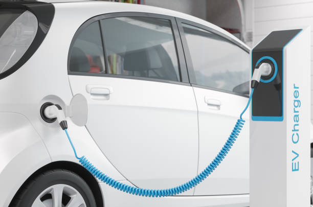 istock Charging Electric Car in Garage 1220174504
