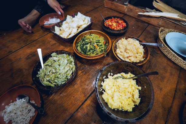 Local Bhutan food that you should try Bhutan local delicacies including chilli cheese and all sorts of vegetarian dishes like potato, red chili and more bhutan stock pictures, royalty-free photos & images