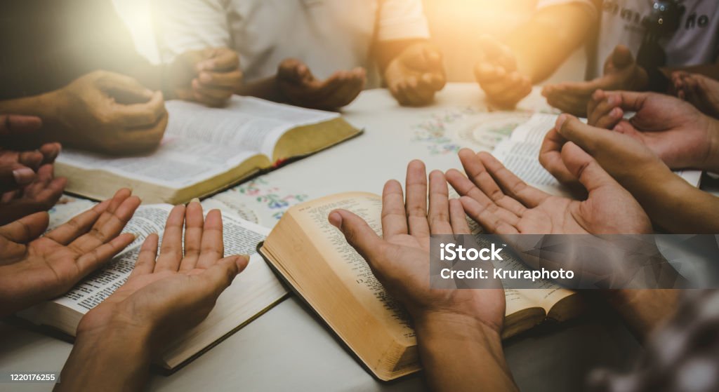 Christian Bible Study Concepts Christian followers are studying the word of God in churches. Praying Stock Photo