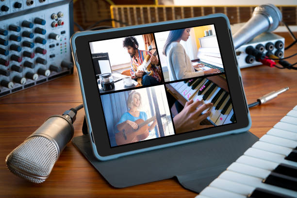 istock Music teleconference with tablet on wood table microphone music stuff 1220176260