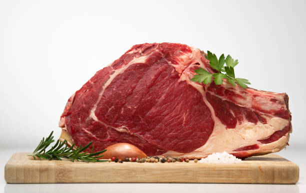 istock Raw T Bone steak on wooden board prepared to Grill 1220176892
