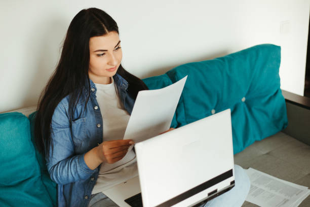 istock Young woman working from home online using laptop 1220178704