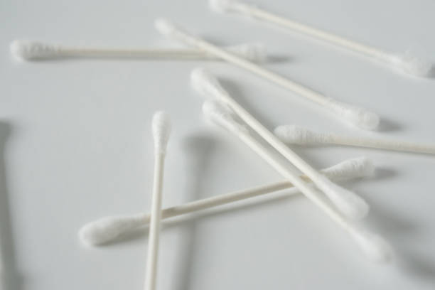 istock Q tip, or cotton bud swab top view on horizontal white background with blank empty space for copy or text; Features best health care hygiene practices to clean ear. 1220181289