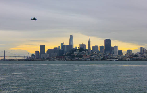 istock San Francisco Skyline Panorama during Sunset, with a Helicopter in the foreground 1220181552