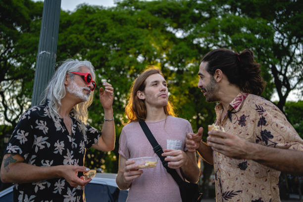 istock Hungry friends eating food and talking 1220182896