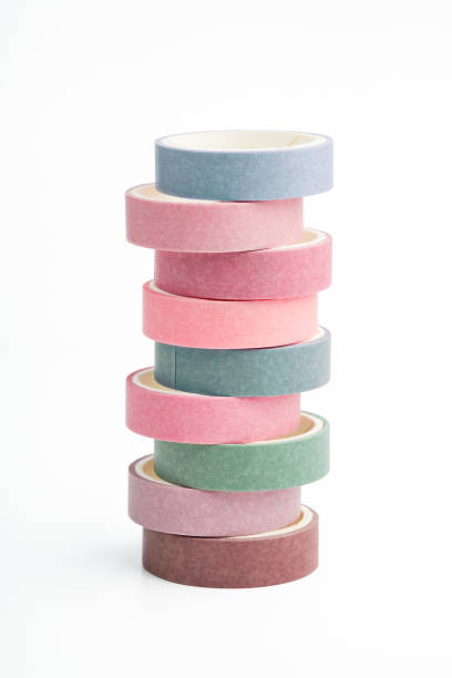 istock Stack of multi-colored rolls of washi tape on a white background 1220184329