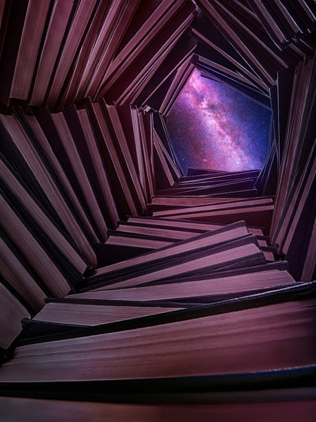 A well made of books with a starry sky above it