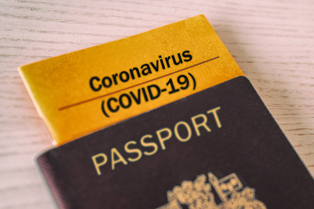 Coronavirus COVID-19 Vaccination proof booklet in passport. Travel ban health certificate Corona screening of travelers tourists. Closure of airports restricted traveling Coronavirus COVID-19 Vaccination proof booklet in passport. Travel ban health certificate Corona screening of travelers tourists. Closure of airports restricted traveling. south korea photos stock pictures, royalty-free photos & images