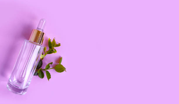 istock cosmetic serum, green leaf, background 1220186645