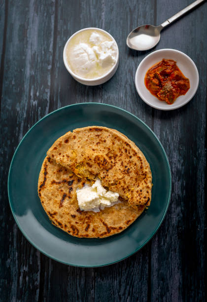 istock stuffed dal paratha with curd, pickle and white butter 1220187410