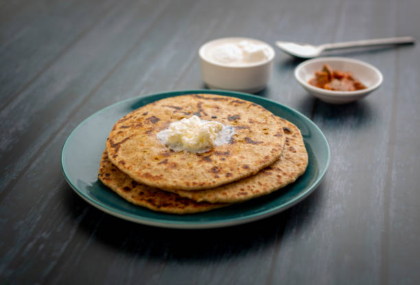 istock stuffed dal paratha with curd, pickle and white butter 1220187529