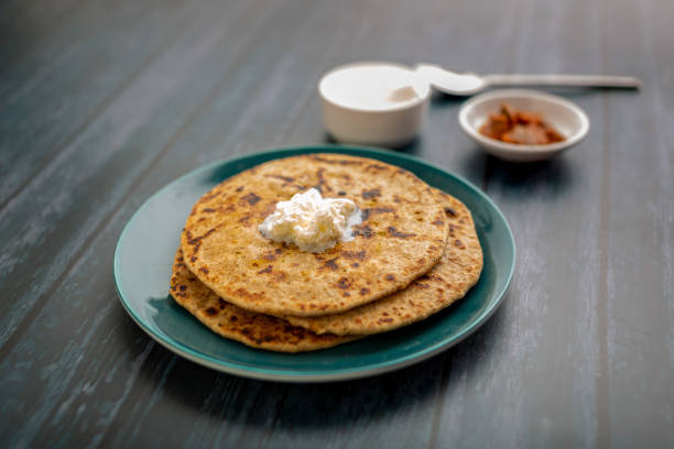 istock stuffed dal paratha with curd, pickle and white butter 1220187582
