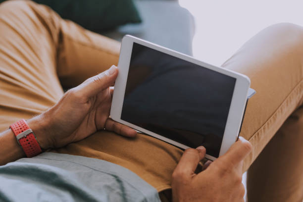 istock Close up of a Man's Hands Holding a Tablet With a Blank Screen (Copy Space) 1220189205