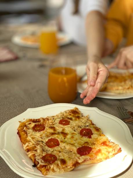 istock Slice of a freshly baked pizza on the plate 1220189452