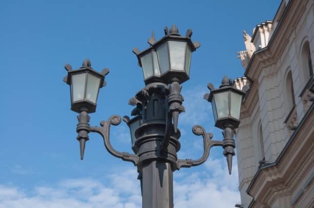 istock Beautiful street lights amid blue skies, white clouds and building 1220189549