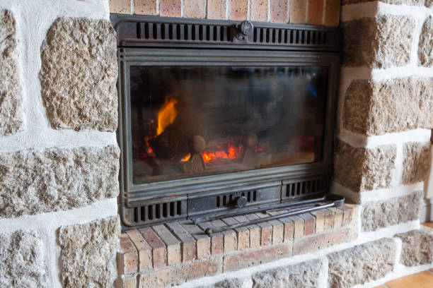 istock Fireplace insert in a living room 1220193186