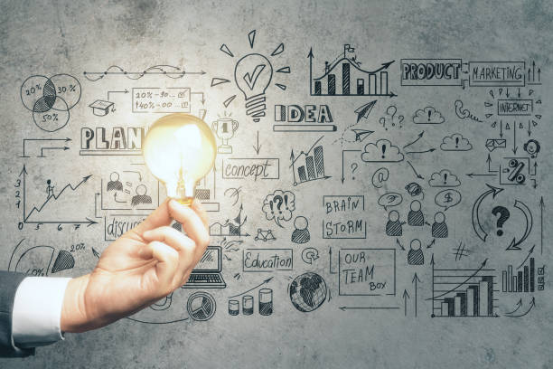 istock Businessman hand holding lamp 1220195935