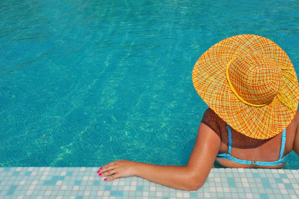istock Real female beauty relaxing in swimming pool 1220196446