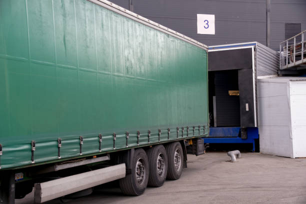 istock unloading a cargo truck near the gate 1220196477