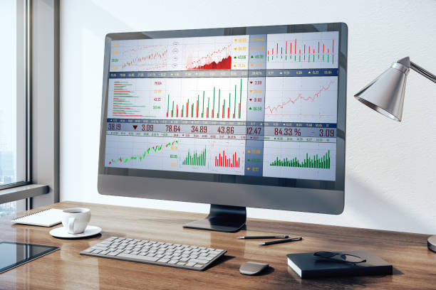 istock Top view computer monitor with stock chart 1220197404