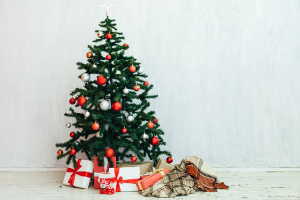 istock Christmas tree gifts winter background holiday new year 1220197561