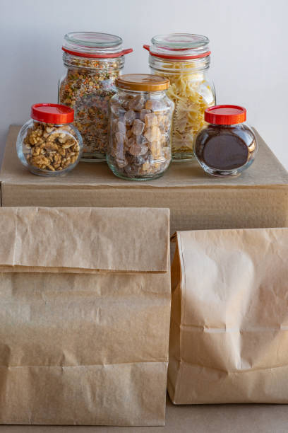 istock Different food with cardboard box and paper bags, donation concept 1220197619