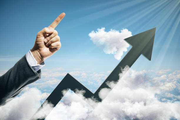 istock Businessman hand points up and black growing arrow 1220197797