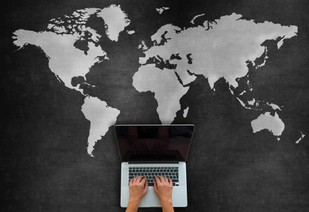 istock Global Business Concept With Laptop On Blackboard 1220197857