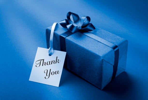 white gift box with Thank You note on blue background.