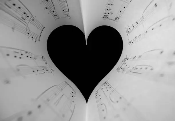 Photo of Heart music notes. The black and white concept of the love of music. Foreground soft focus.
