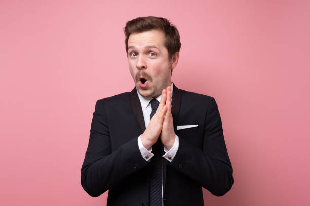 istock Happy businessman in suit standing and applauding 1220199601