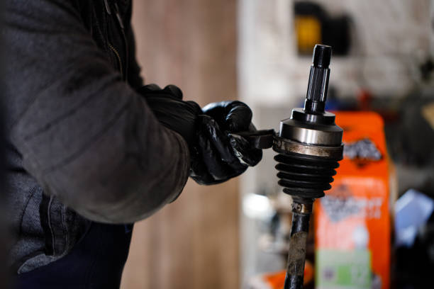istock The car wheel shaft mechanic has checked and repaired 1220200726