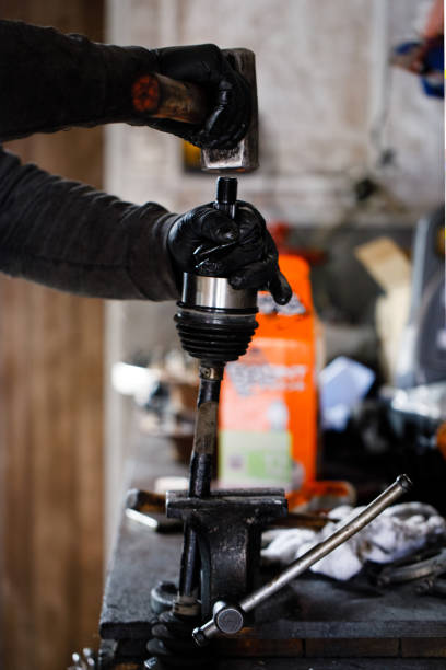 istock The car wheel shaft mechanic has checked and repaired 1220202277