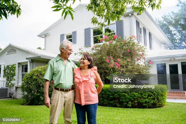 Embracing Latin American Seniors In Backyard Of Miami Home Stock Photo - Download Image Now