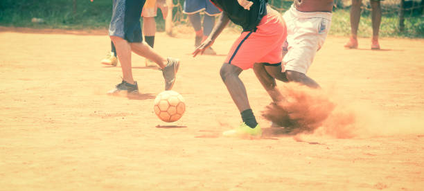 istock Brazilians playing soccer on a dirt field 1220211073