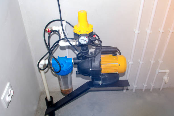 motor for a water pump in a pump room against a white wall