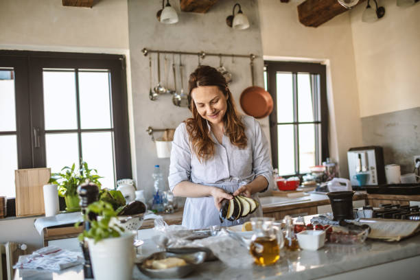 istock Woman cooking mediterranean food for dinner 1220213733