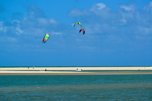 Kite surfing at the mouth of the ceara-mirim river in the village of Genipabu, Extremoz, near Natal, Rio Grande do Norte, Brazil on February 8, 2014