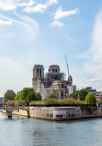 Paris, France - April 17, 2019: Notre Dame de Paris, the day after. Reinforcement work in progress after the fire, to prevent the Cathedral from collapsing.