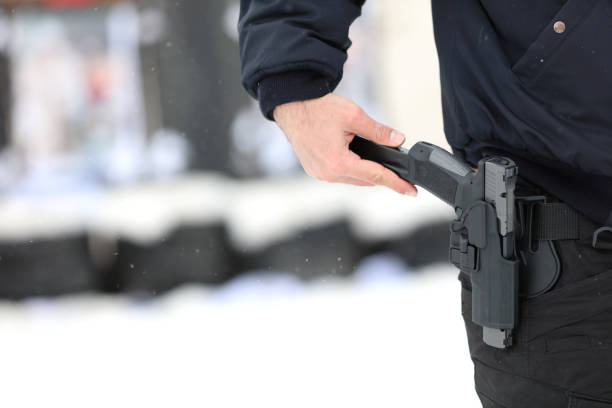 A man holding a gun in case