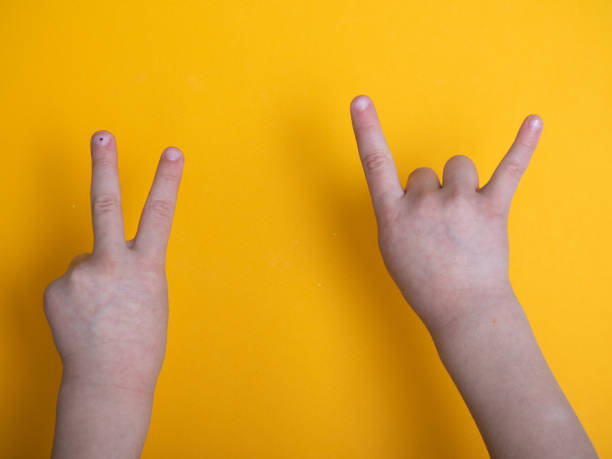 istock isolated child hand shows different sign 1220220003