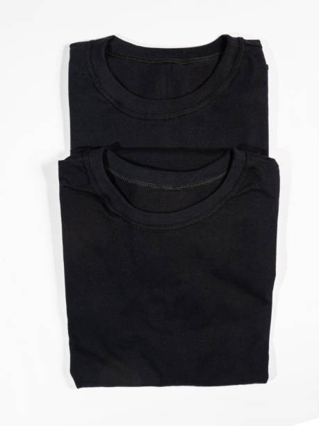 istock black shirt isolated on white 1220221264