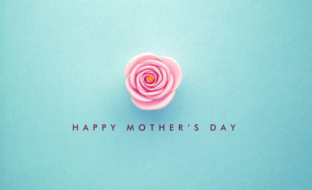 Pink rose and Happy Mother's Day message over turquoise background. Horizontal composition with copy space. Happy Mother's Day concept.