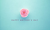 Pink Rose and Happy Mother's Day Message on Teal Background